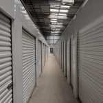 Self storage facility hallways with rollup doors
