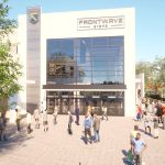 A closer look at the entrance, highlighting the modern architectural design and ample gathering spaces.